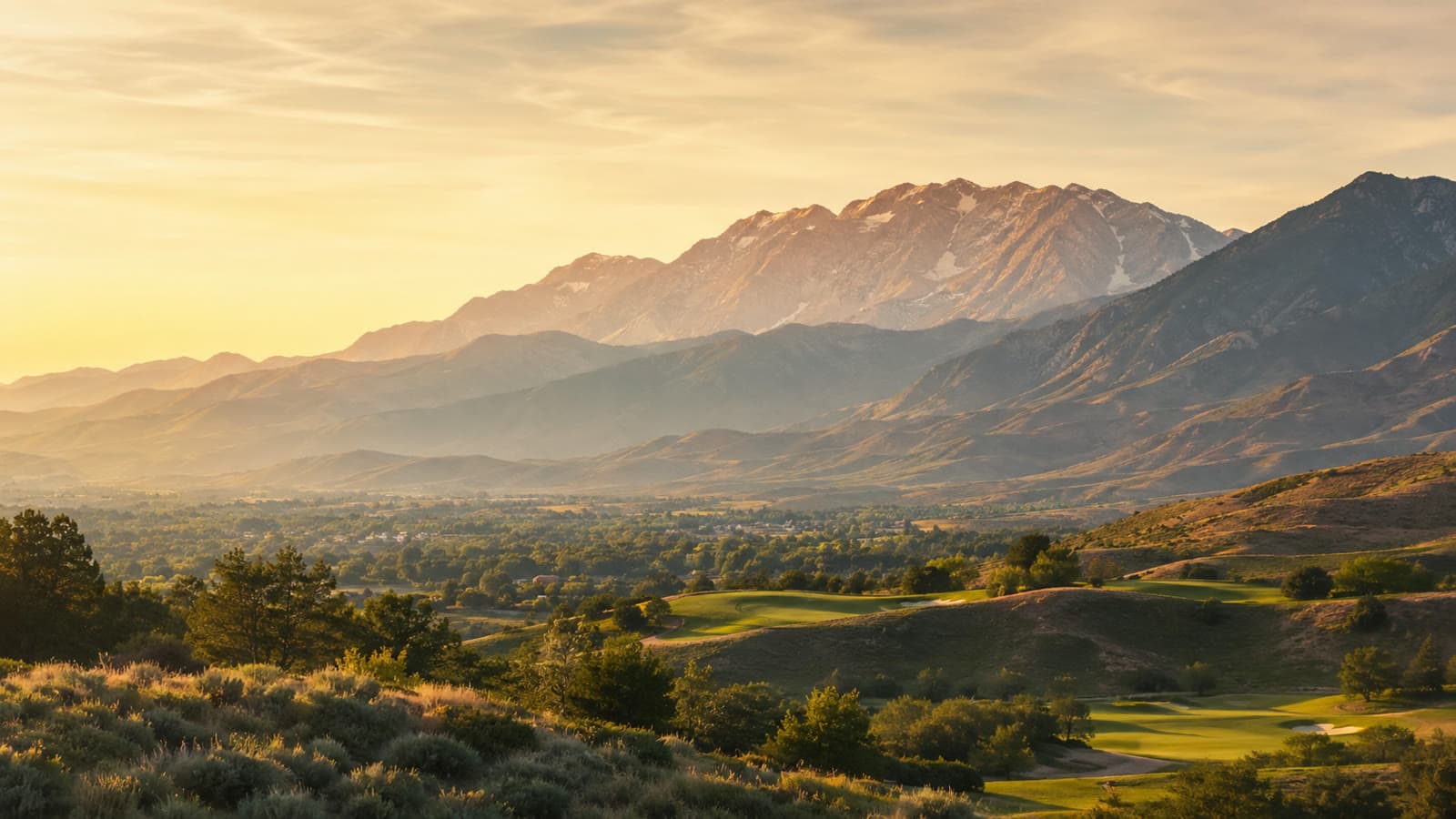 Golden-hour light over the Wasatch mountains above Ogden